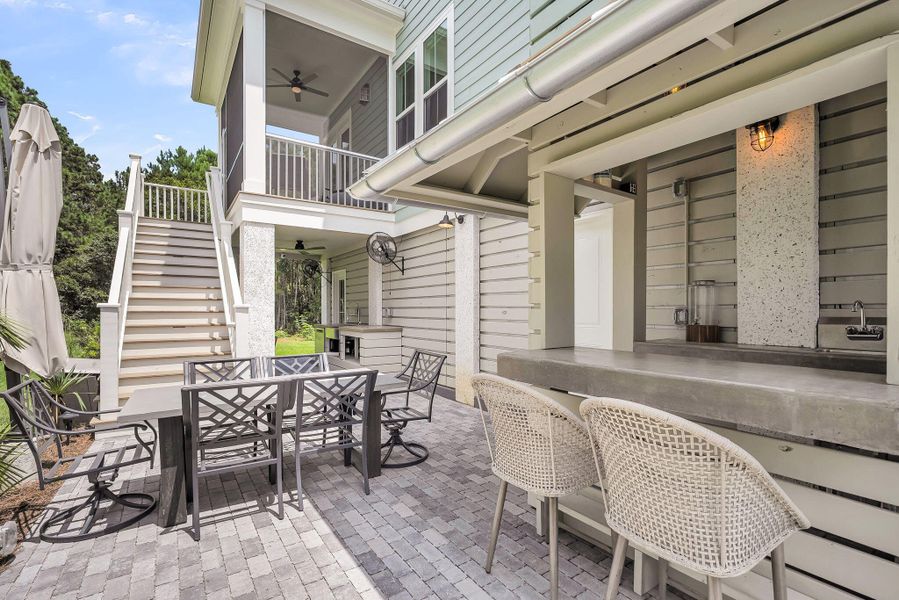 Exterior details and patio area of a home in Overlook at Copahee Sound, Awendaw (Image 37).