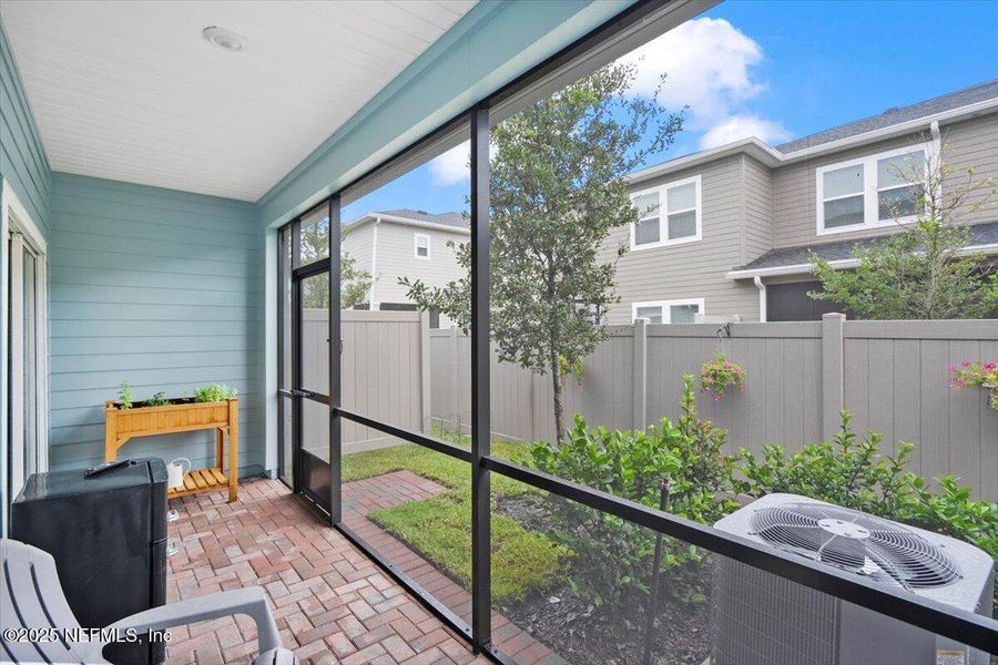 Exterior details and patio area of a home in Shearwater: Affordable Luxury Townhomes, St. Augustine (Image 20).