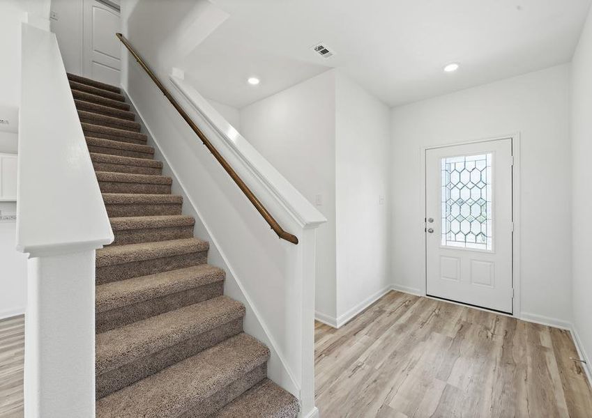 A gorgeous foyer leads tot he family room