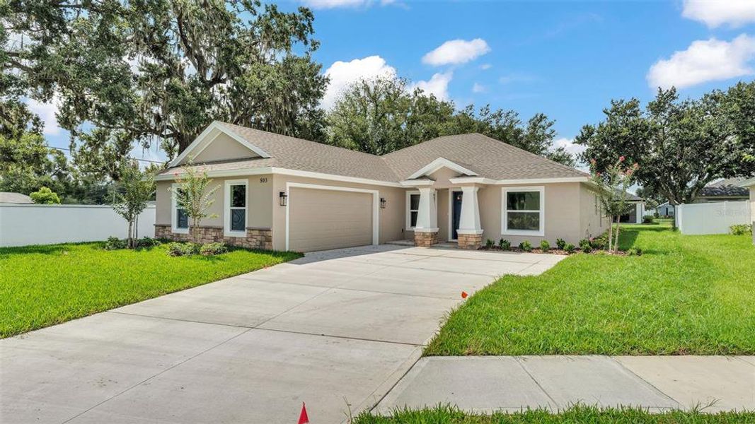 Front exterior of a new home in , Bartow, FL, highlighting curb appeal (Image 29).