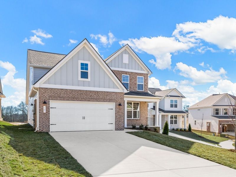 Front exterior of a new home in Woods Crossing, Gallatin, TN, highlighting curb appeal (Image 29).
