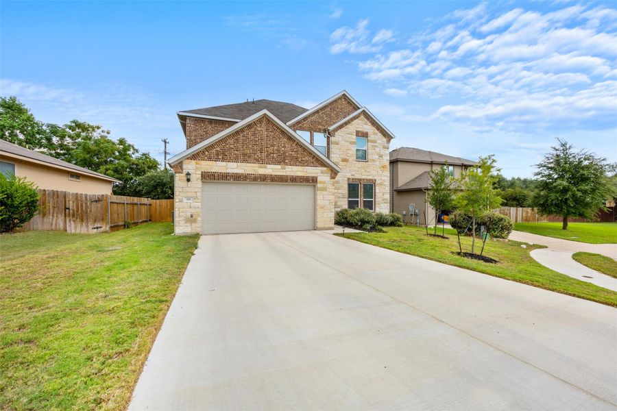 Front exterior of a new home in Stonewall Ranch 50s, Liberty Hill, TX, highlighting curb appeal (Image 2).