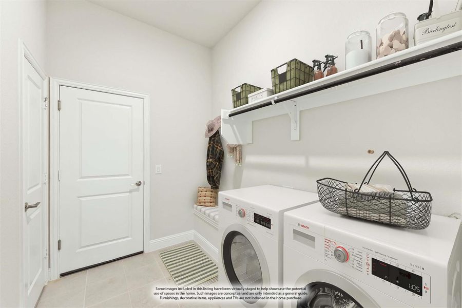 Laundry room with front-load washer and dryer, wall shelf with storage baskets, and hanging rod Laundry room with front-load washer and dryer, wall shelf with storage baskets, and hanging rod