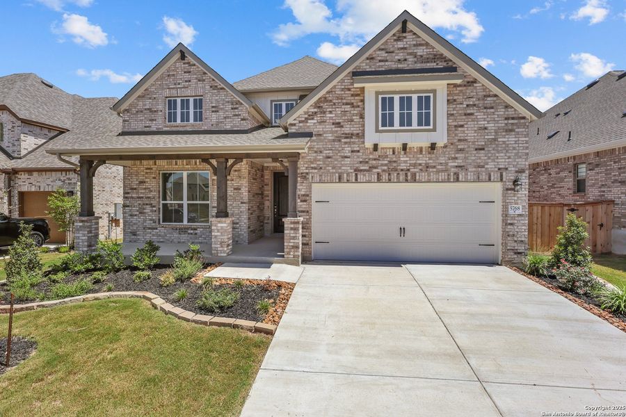 Front exterior of a new home in Mayfair 50', New Braunfels, TX, highlighting curb appeal (Image 18).