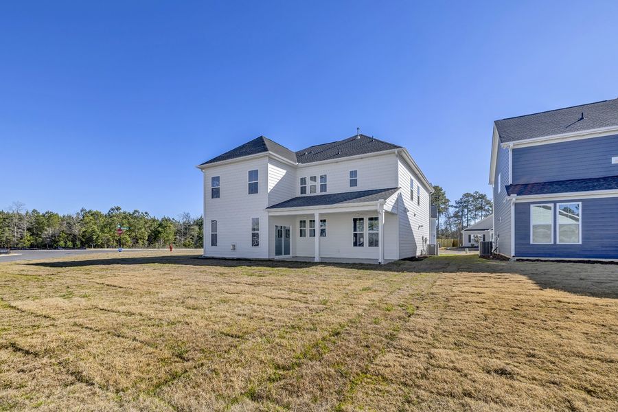 Exterior details and patio area of a home in Grand Park, Leland (Image 19).