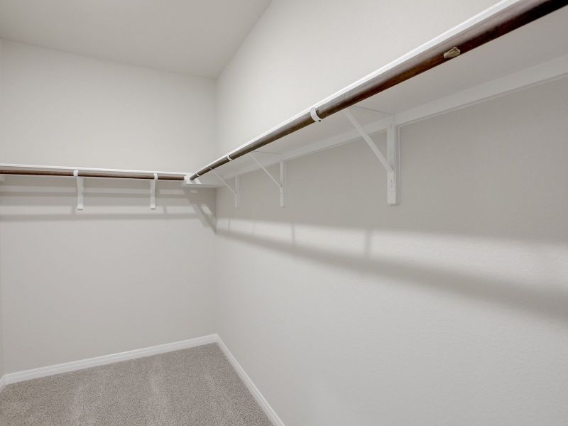 The large primary closet provides plenty of room for storage.