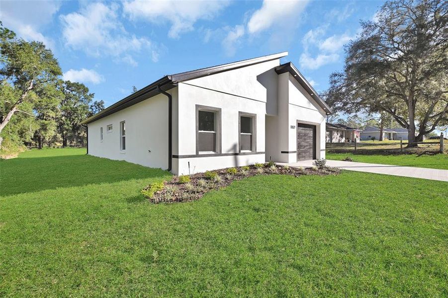 Front exterior of a new home in , Dunnellon, FL, highlighting curb appeal (Image 27).