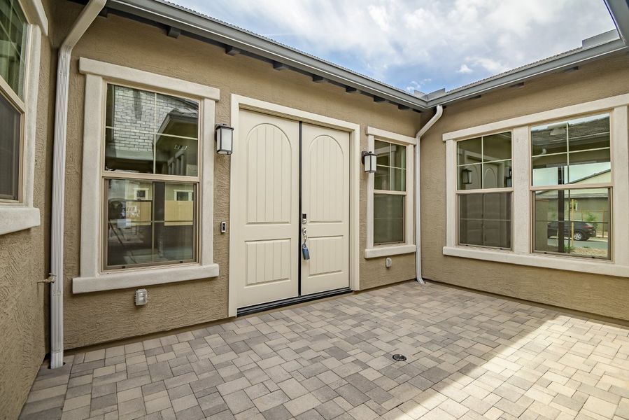 Exterior details and patio area of a home in Elegance at Eastmark, Mesa (Image 4).