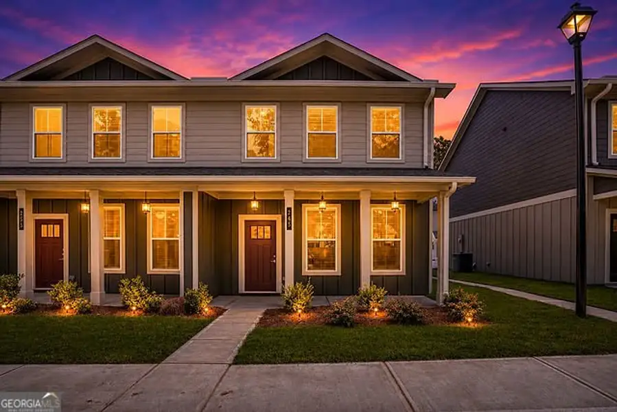 Front exterior of a new home in The Cottages at East Lanier, Fayetteville, GA, highlighting curb appeal (Image 2). Front exterior of a new home in The Cottages at East Lanier, Fayetteville, GA, highlighting curb appeal (Image 2).