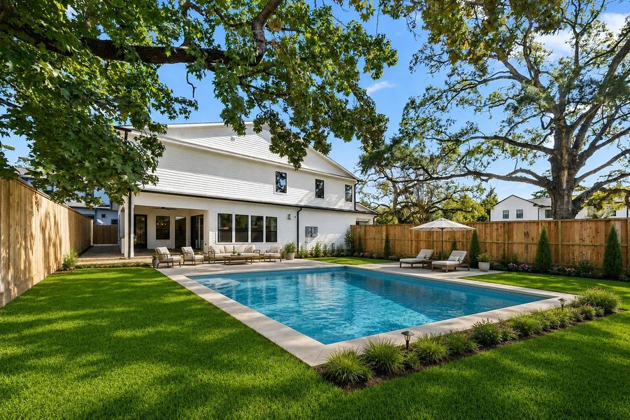 Pool rendering example in existing back yard space. *Pool not included with home*