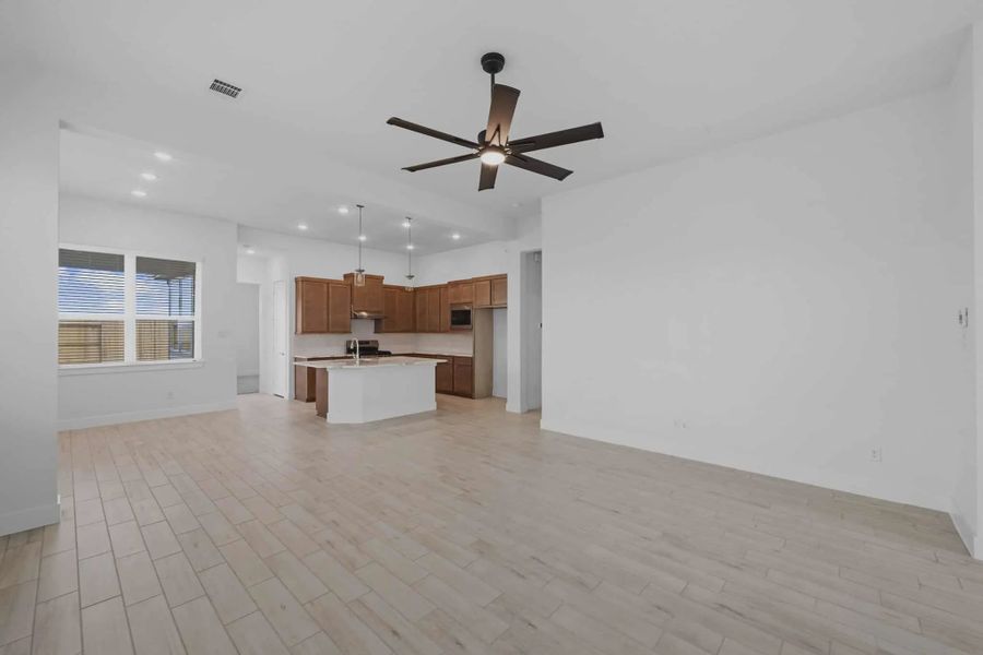 Representative unfurnished interior of a home built from the Archer by Chesmar Homes in Santa Rita Ranch, Liberty Hill (Image 9).