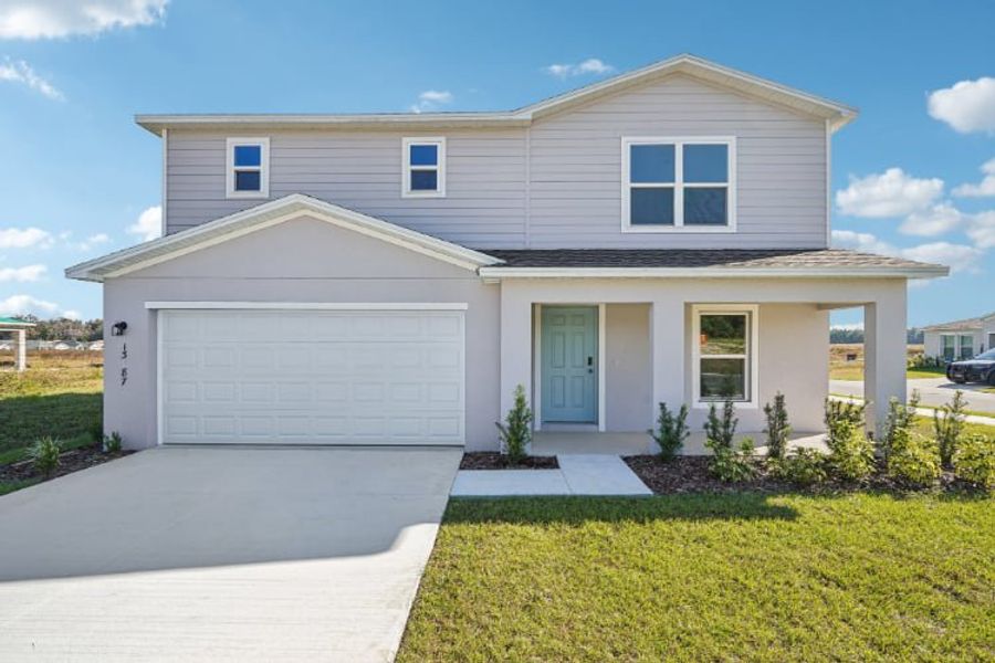 Front exterior of a new home in Bennah Oaks, Belleview, FL, highlighting curb appeal (Image 1).