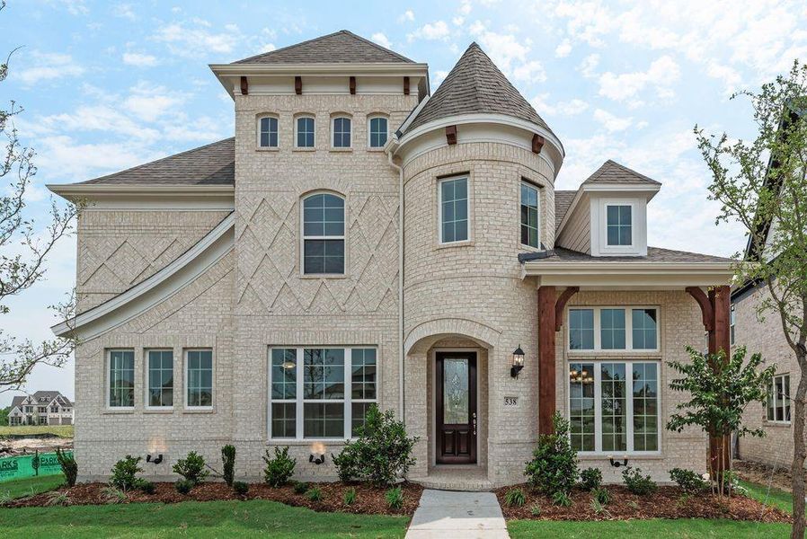 Front exterior of a new home in Edgewater, Fate, TX, highlighting curb appeal (Image 2). Front exterior of a new home in Edgewater, Fate, TX, highlighting curb appeal (Image 2).
