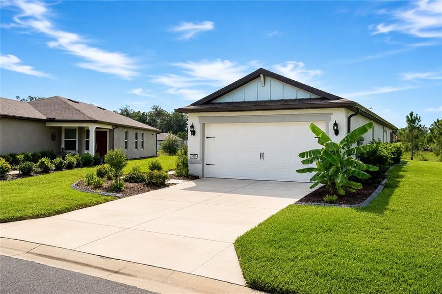 Front exterior of a new home in , Ocala, FL, highlighting curb appeal (Image 2). Front exterior of a new home in , Ocala, FL, highlighting curb appeal (Image 2).