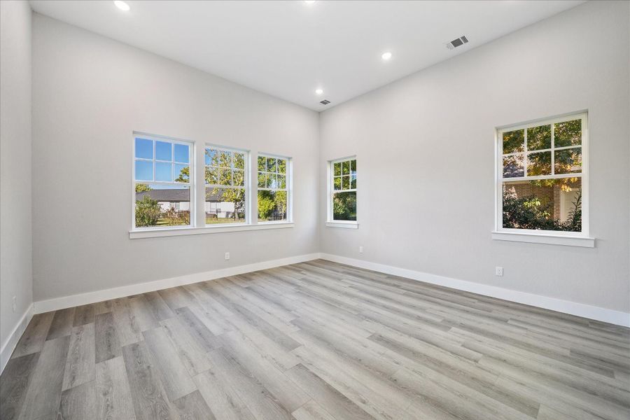 The Primary Bedroom is rich in Recessed Lighting and natural light that floods in from the North and East