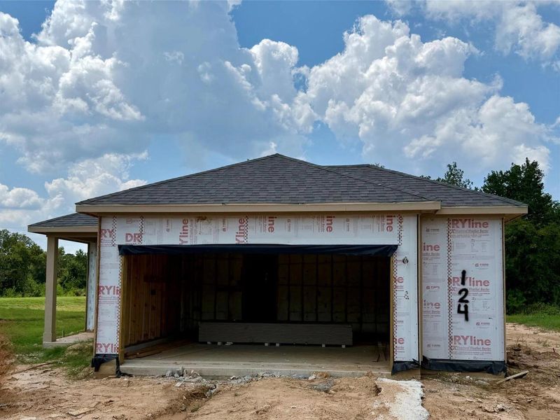 Exterior details and patio area of a home in Caney Creek Place, Conroe (Image 2).