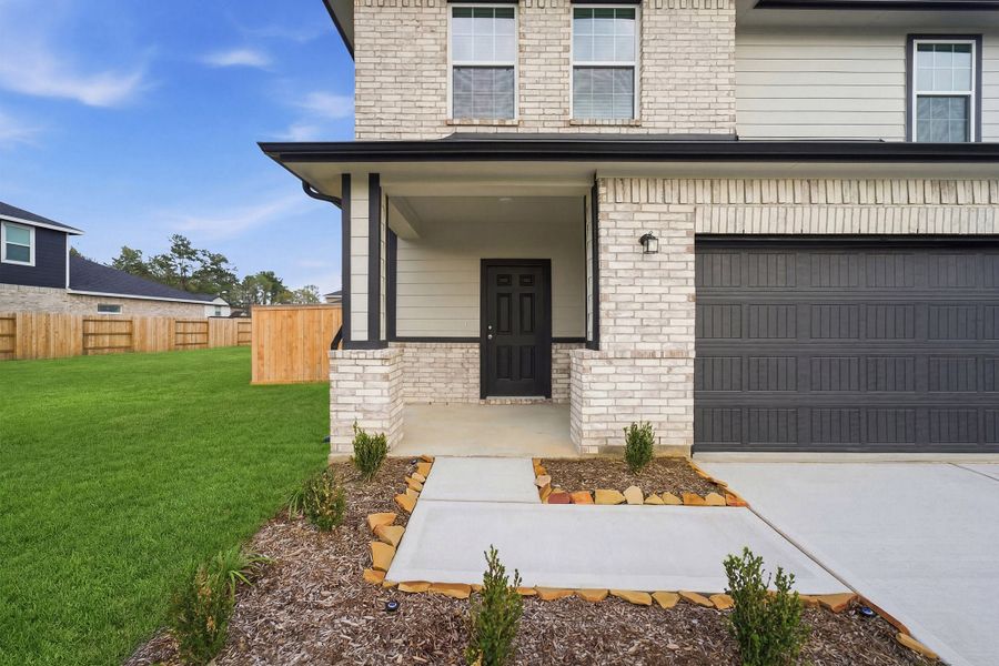 Exterior details and patio area of a home in The Canopies, Splendora (Image 3).