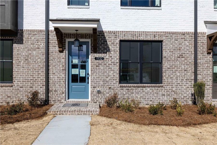 Exterior details and patio area of a home in Millcroft Townhomes, Buford (Image 22). Exterior details and patio area of a home in Millcroft Townhomes, Buford (Image 22).