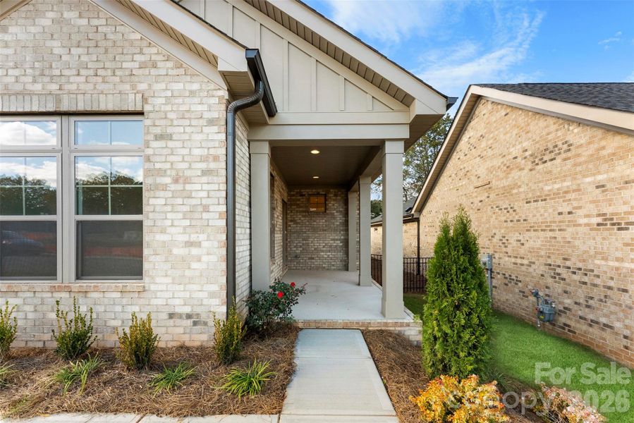 Exterior details and patio area of a home in The Courtyards on New Hope, Gastonia (Image 19).