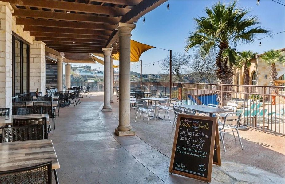 Front exterior of a new home in Rough Hollow The District, Lakeway, TX, highlighting curb appeal (Image 12). Front exterior of a new home in Rough Hollow The District, Lakeway, TX, highlighting curb appeal (Image 12).