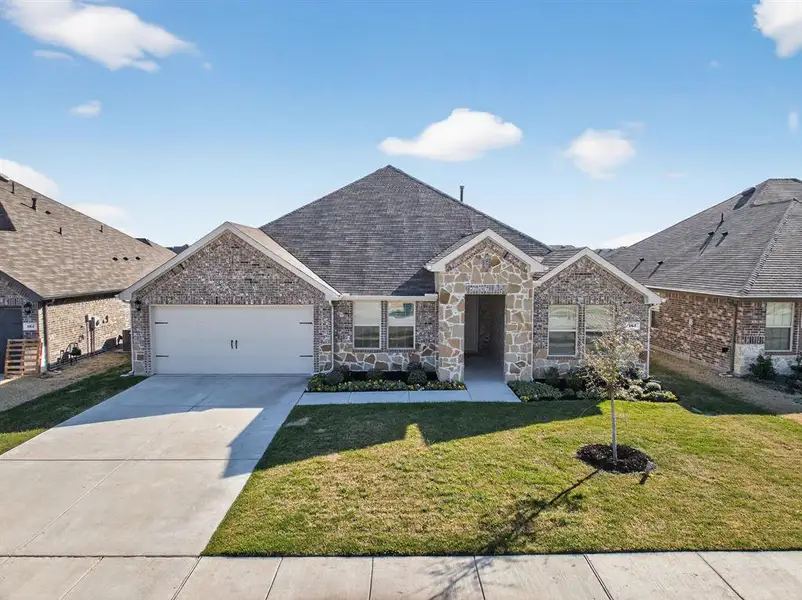 Front exterior of a new home in , Caddo Mills, TX, highlighting curb appeal (Image 1). Front exterior of a new home in , Caddo Mills, TX, highlighting curb appeal (Image 1).