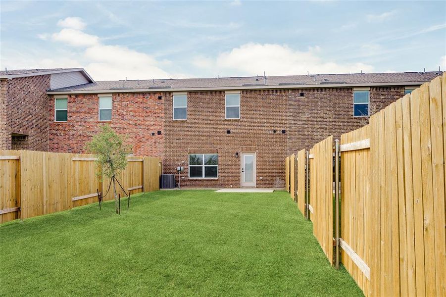 This is an example of the backyard at 485 MB's Way. All backyards are fenced, landscaped, and have a concrete patio. This is an example of the backyard at 485 MB's Way. All backyards are fenced, landscaped, and have a concrete patio.