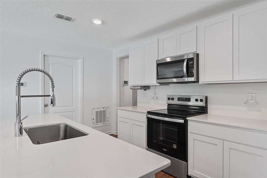 Furnished interior view inside a new home in Sawmill Branch, Palm Coast (Image 7).