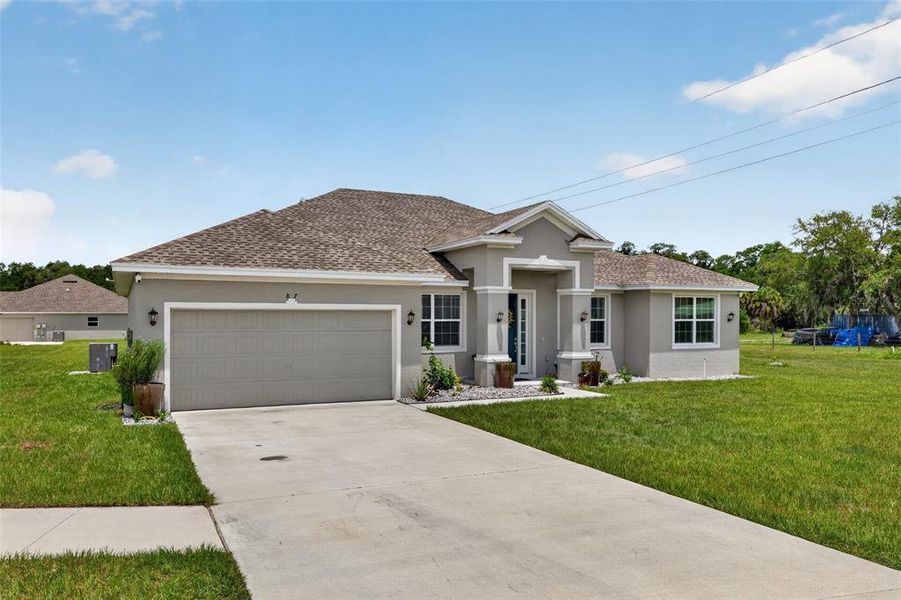 Front exterior of a new home in , Bartow, FL, highlighting curb appeal (Image 21). Front exterior of a new home in , Bartow, FL, highlighting curb appeal (Image 21).