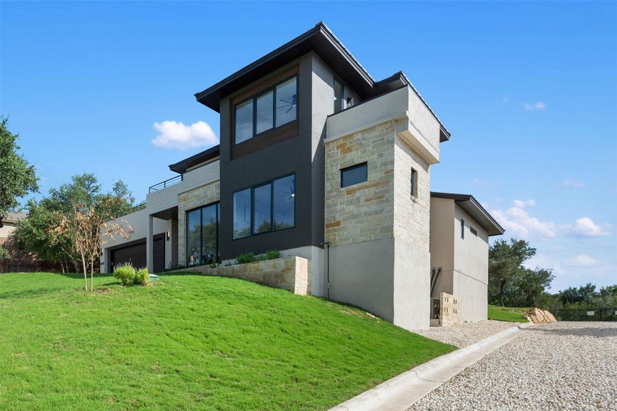 Front exterior of a new home in , Austin, TX, highlighting curb appeal (Image 25). Front exterior of a new home in , Austin, TX, highlighting curb appeal (Image 25).