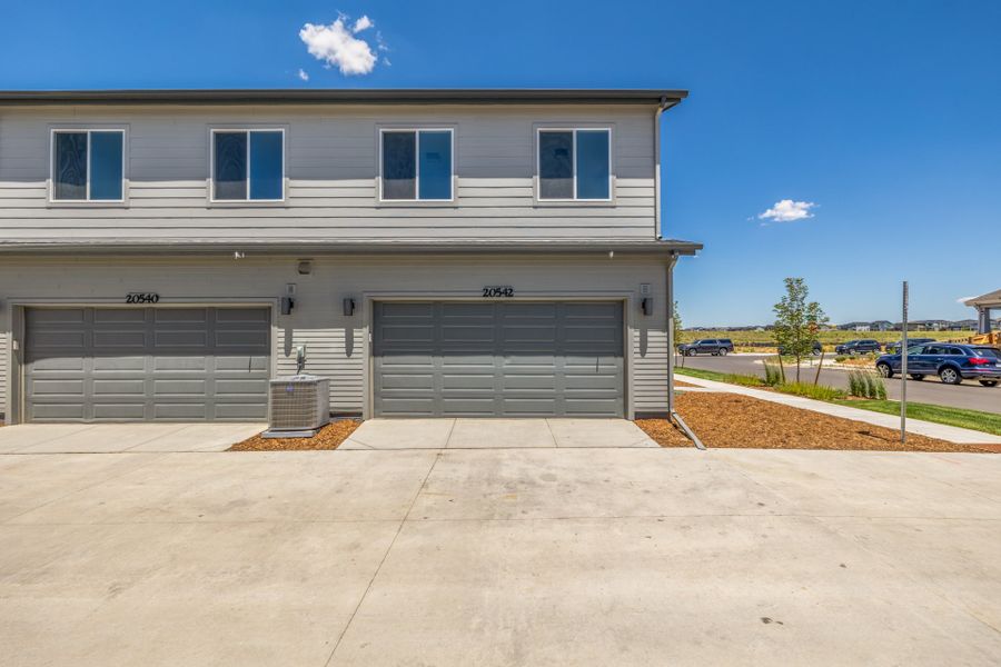 Front exterior of a new home in Painted Prairie, Aurora, CO, highlighting curb appeal (Image 22).