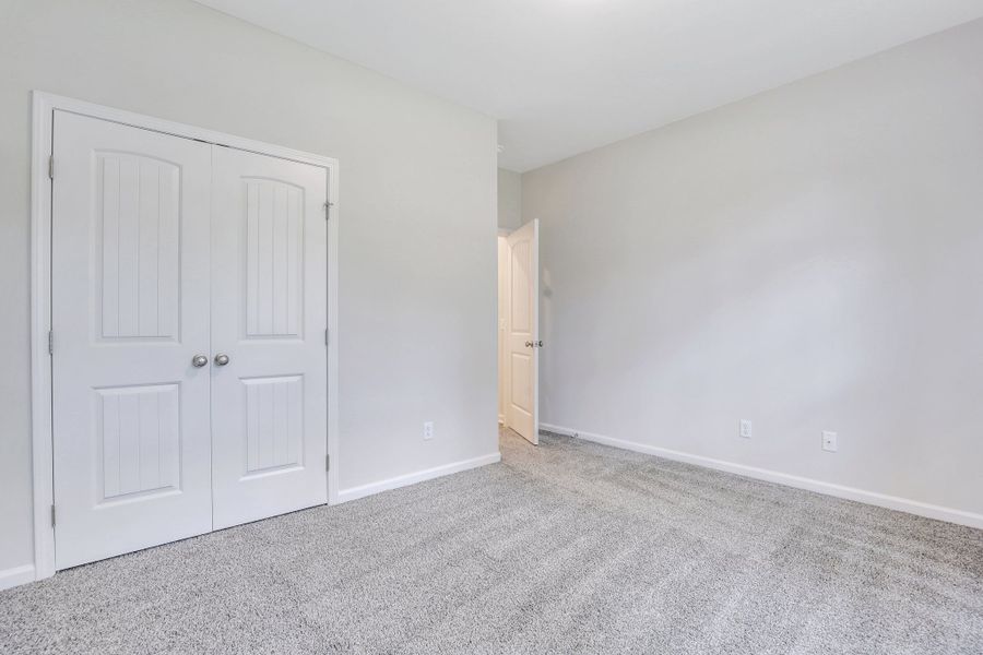 Representative unfurnished interior of a home built from the The Brookhaven by Smith Family Homes in Ramsey Landing, Rincon (Image 34).