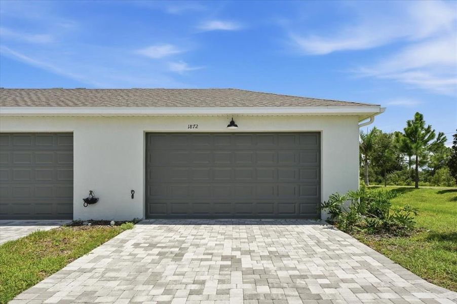 Front exterior of a new home in , Sarasota, FL, highlighting curb appeal (Image 25).