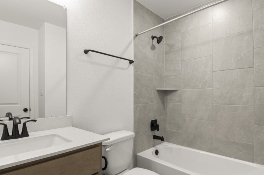 Furnished interior view inside a new home in Trace, San Marcos (Image 18).