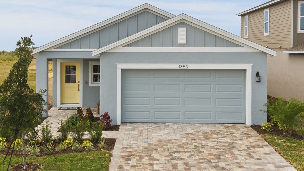 Front exterior of a new home in Liberty Trace, Haines City, FL, highlighting curb appeal (Image 2). Front exterior of a new home in Liberty Trace, Haines City, FL, highlighting curb appeal (Image 2).
