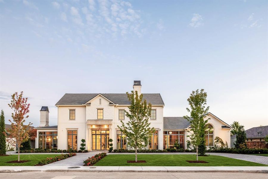 View of front of property featuring a chimney and a front lawn View of front of property featuring a chimney and a front lawn