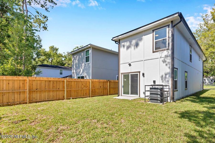 Front exterior of a new home in , Jacksonville, FL, highlighting curb appeal (Image 1).