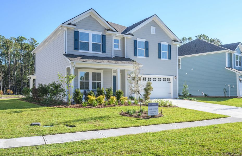 Front exterior of a new home in Waterways, Richmond Hill, GA, highlighting curb appeal (Image 24). Front exterior of a new home in Waterways, Richmond Hill, GA, highlighting curb appeal (Image 24).