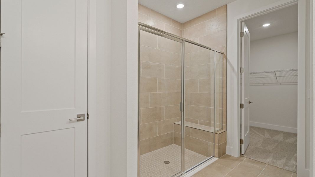 The Primary Suite en suite bath of the Buttonwood by DRB Homes at Trailside in Mount Dora, FL.