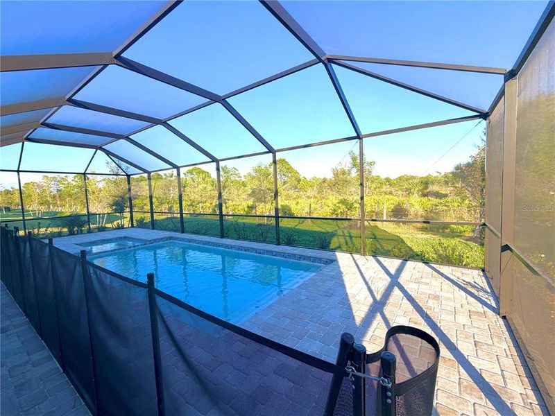 Exterior details and patio area of a home in Island Lakes at Coco Bay: Manor Homes, Englewood (Image 7).