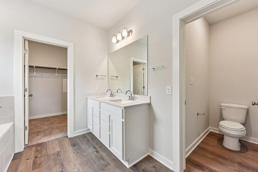 Furnished interior view inside a new home in Stallion Run, Buda (Image 11).