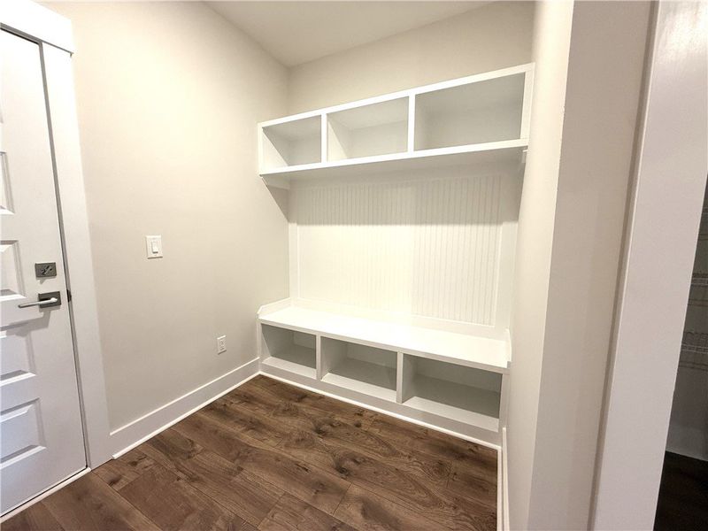 Built-in shelving and bench seating maximize organ Built-in shelving and bench seating maximize organ
