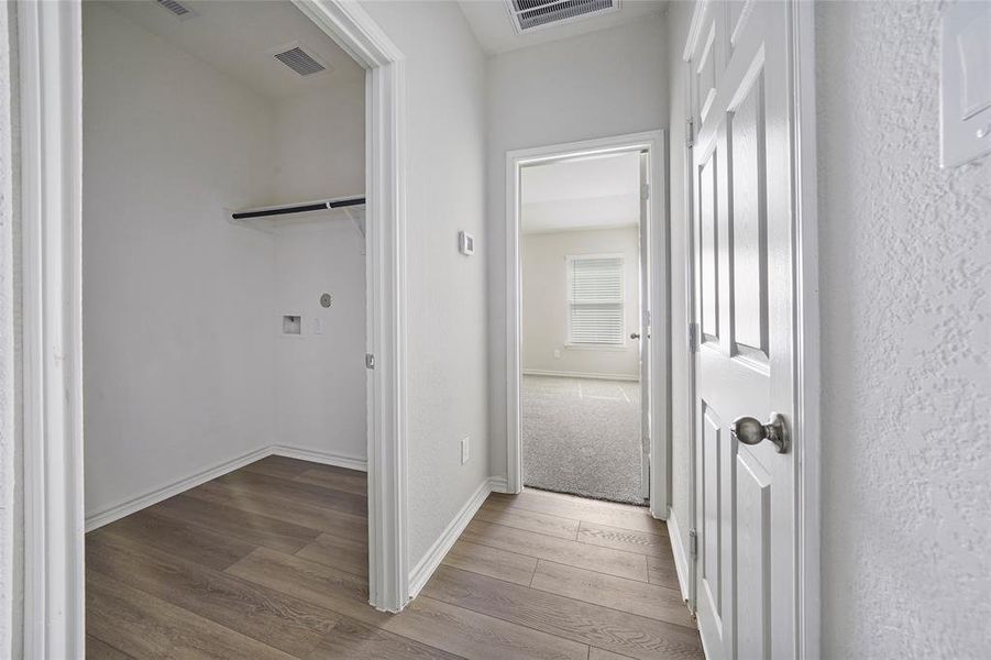 Laundry room leading to guest bedroom 3