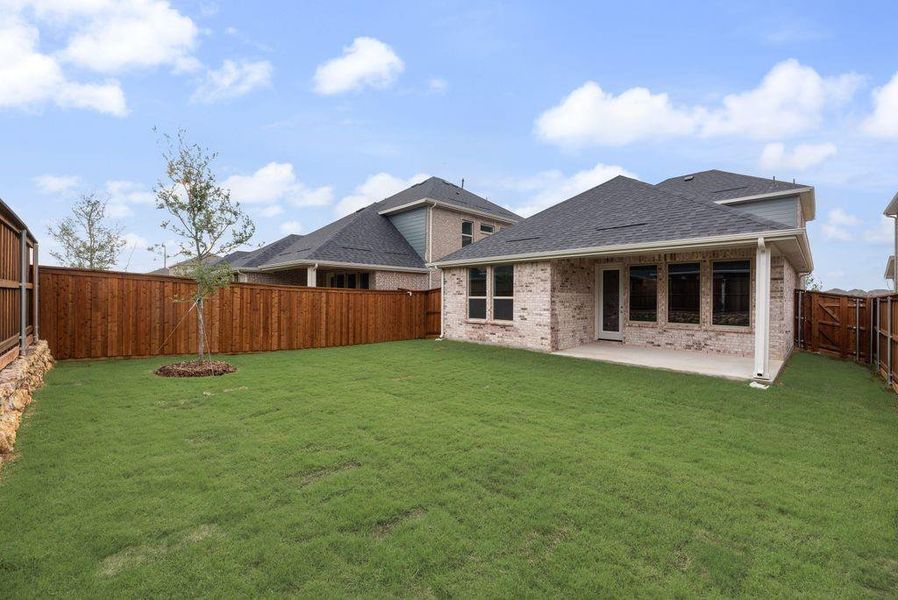 Exterior details and patio area of a home in Spiritas Ranch, Little Elm (Image 4).
