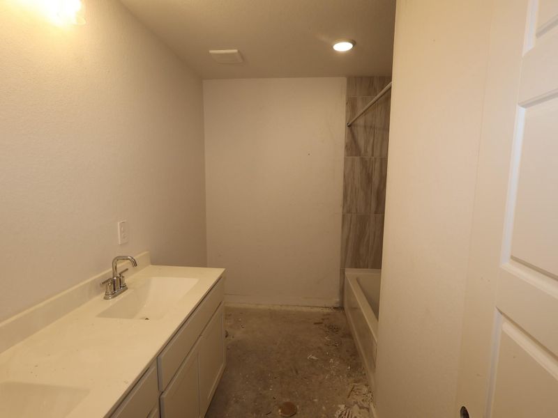 Furnished interior view inside a new home in Pinewood at Grand Texas, New Caney (Image 4).