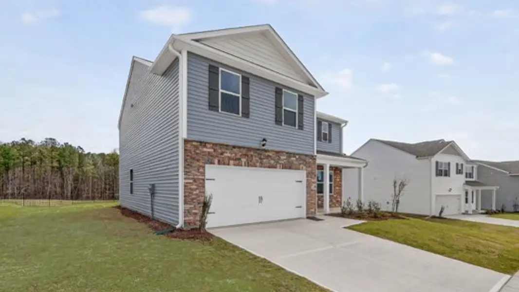 Front exterior of a new home in Lawson Glen, Clayton, NC, highlighting curb appeal (Image 15).