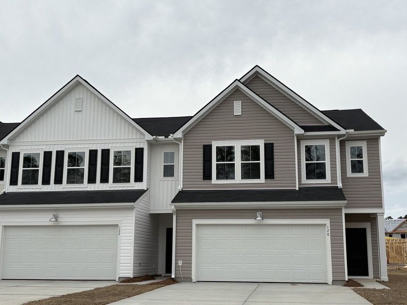 Front exterior of a new home in Dawson Pointe, Summerville, SC, highlighting curb appeal (Image 1). Front exterior of a new home in Dawson Pointe, Summerville, SC, highlighting curb appeal (Image 1).