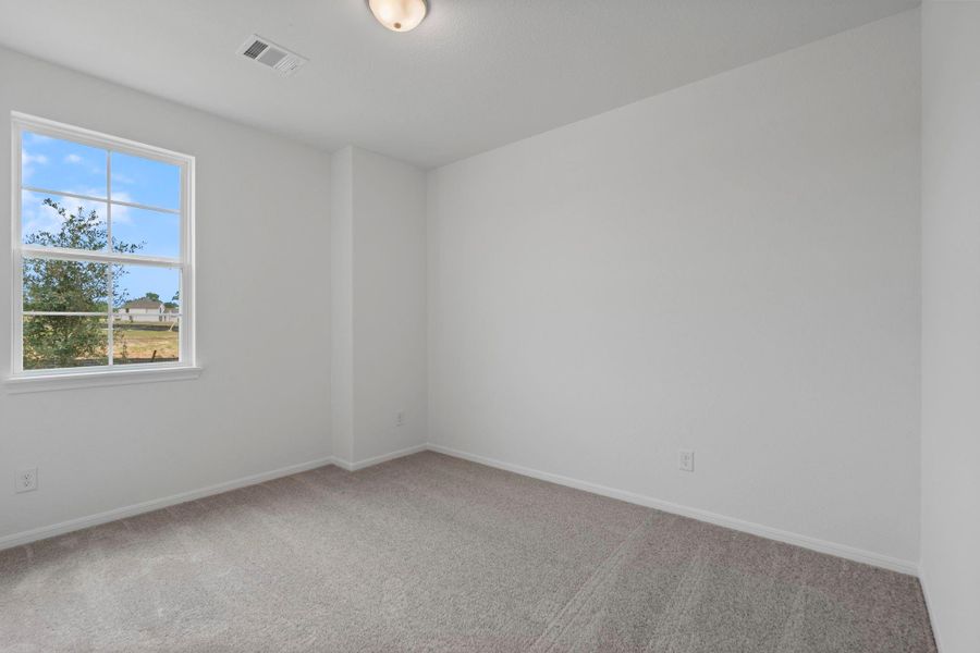 Your secondary bedroom features plush carpet, fresh paint, closet, and a large window that lets in plenty of natural lighting. Your secondary bedroom features plush carpet, fresh paint, closet, and a large window that lets in plenty of natural lighting.