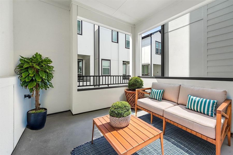 Exterior details and patio area of a home in The Corner At Buffalo Pointe, Houston (Image 3). Exterior details and patio area of a home in The Corner At Buffalo Pointe, Houston (Image 3).