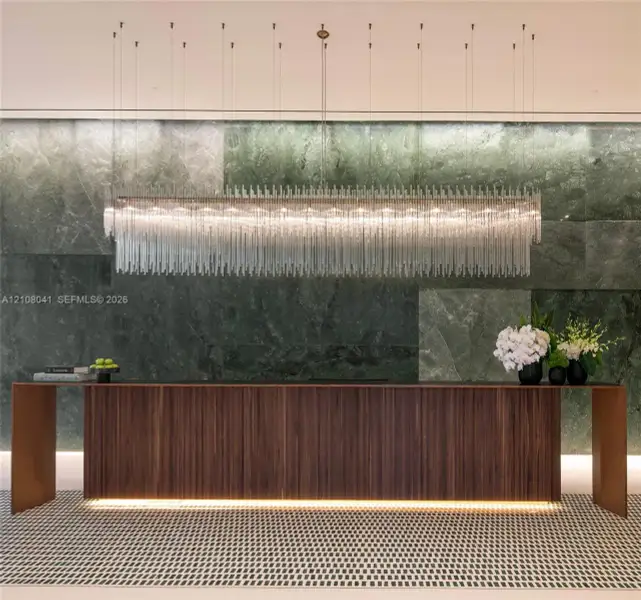 Wood-paneled reception desk with integrated lighting