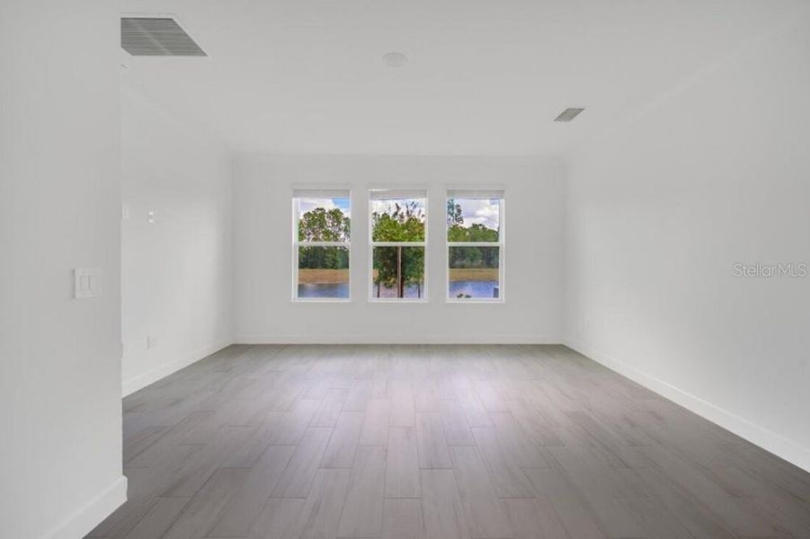 Spacious, unfurnished interior of a new home in Harvest at Ovation, Winter Garden (Image 28).